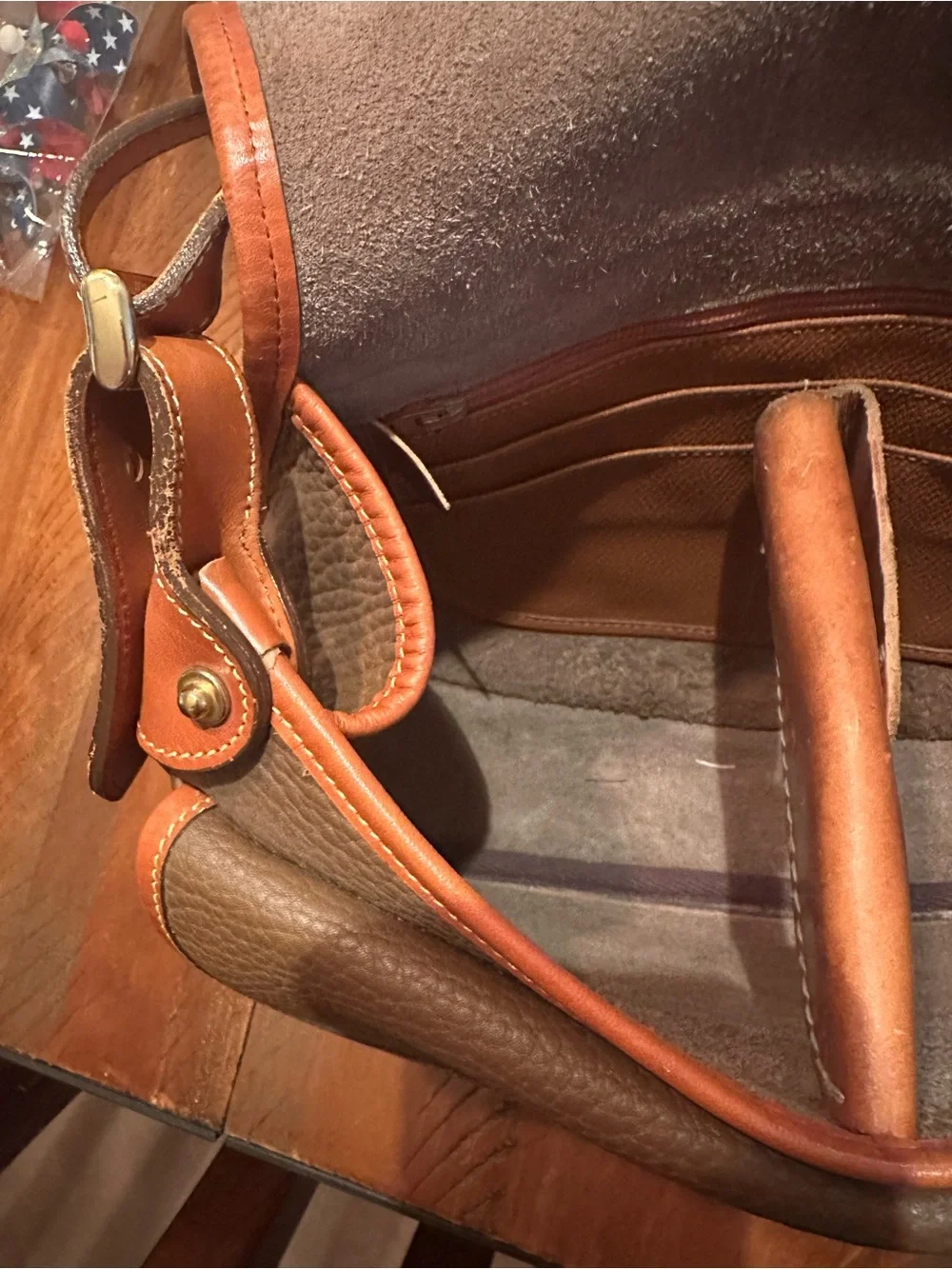 Dooney & Bourke Brown Pebbled Leather Horseshoe Crossbody with Tan Trim